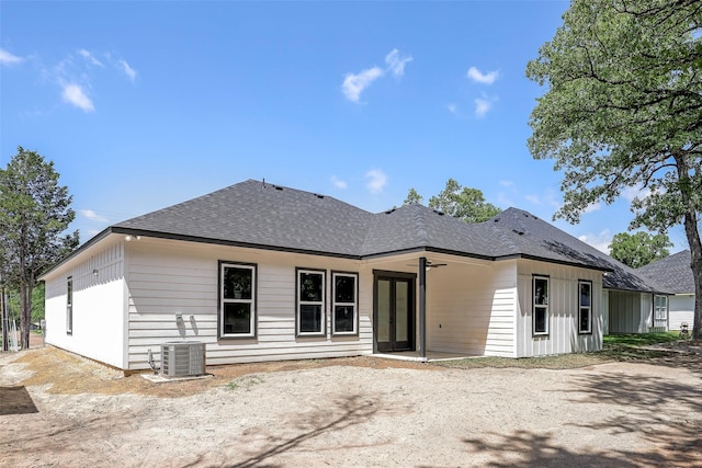 back of property featuring cooling unit and ceiling fan