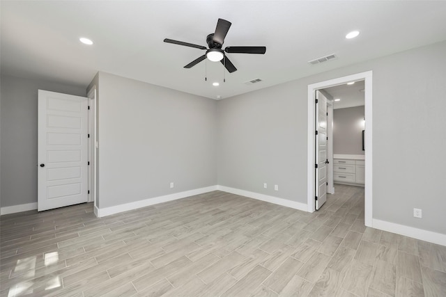 unfurnished room with ceiling fan