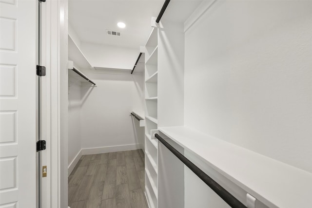 spacious closet featuring light wood-type flooring