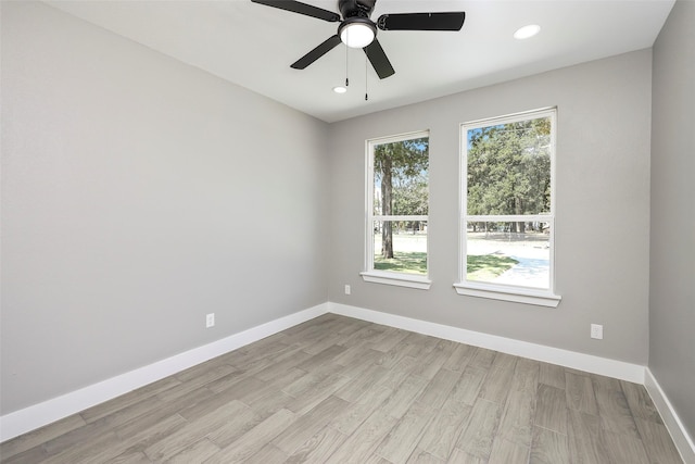 spare room with ceiling fan and light hardwood / wood-style floors