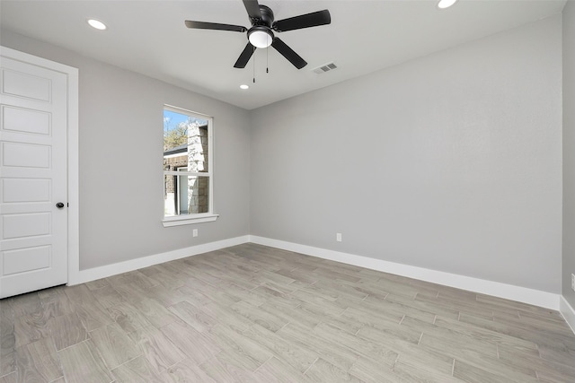 unfurnished room featuring ceiling fan and light wood-type flooring