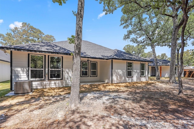 ranch-style house featuring central air condition unit