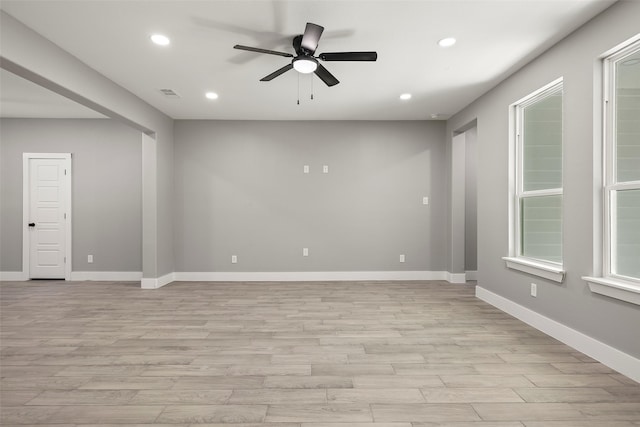 spare room with light hardwood / wood-style flooring and ceiling fan