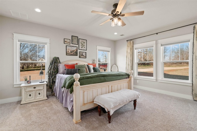 bedroom featuring light colored carpet, recessed lighting, visible vents, and baseboards