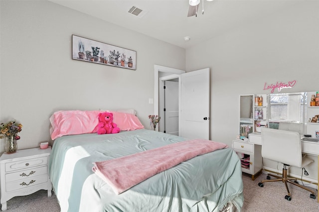 bedroom featuring ceiling fan, visible vents, and light colored carpet