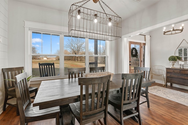 dining room featuring a notable chandelier and wood finished floors