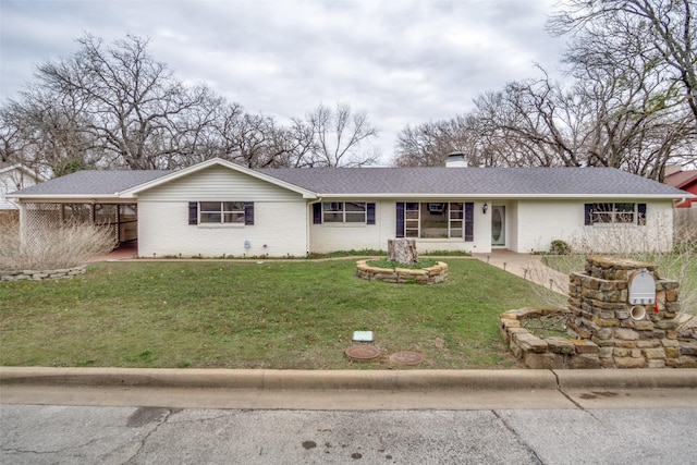 ranch-style house with a carport and a front lawn