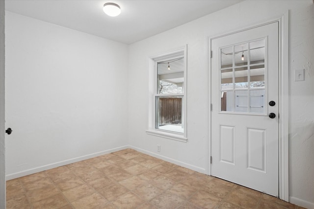 interior space featuring baseboards