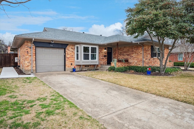 ranch-style home with a garage, brick siding, driveway, and a front lawn