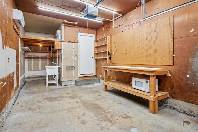 garage with a garage door opener and a workshop area