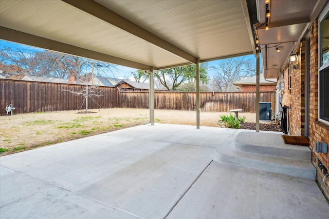 view of patio / terrace with a fenced backyard and central AC