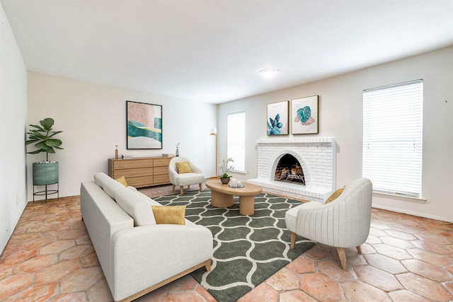 living area featuring a brick fireplace