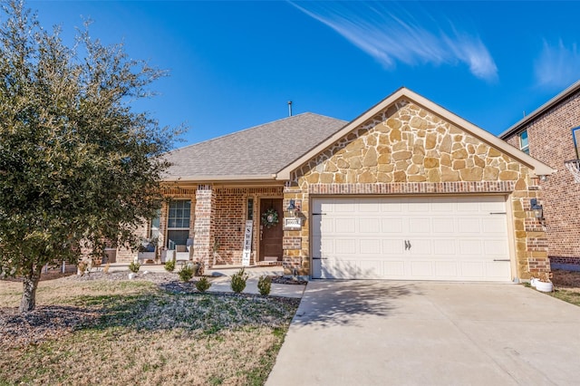 view of front of house featuring roof with shingles, a porch, a garage, stone siding, and driveway