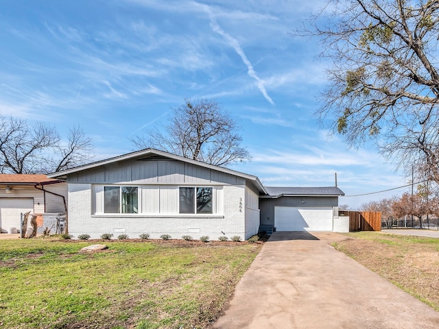 view of front of home with a garage and a front yard