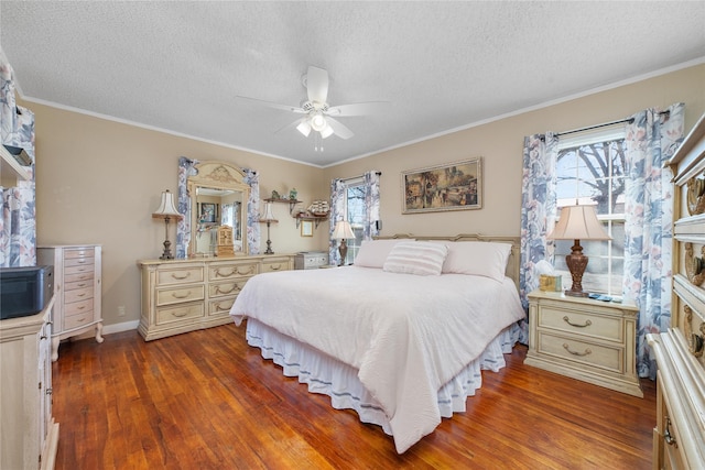 bedroom with crown molding, a textured ceiling, baseboards, and wood finished floors