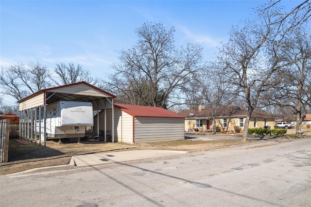 exterior space with a detached carport