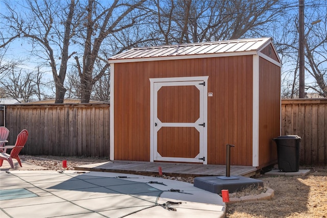 view of shed with a fenced backyard