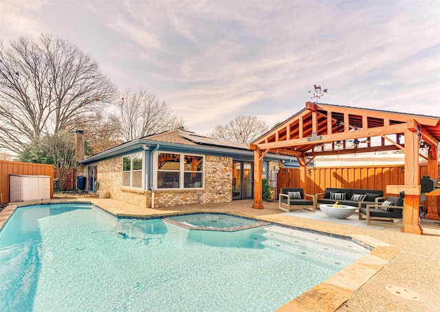 view of swimming pool featuring an in ground hot tub, a gazebo, outdoor lounge area, and a patio area