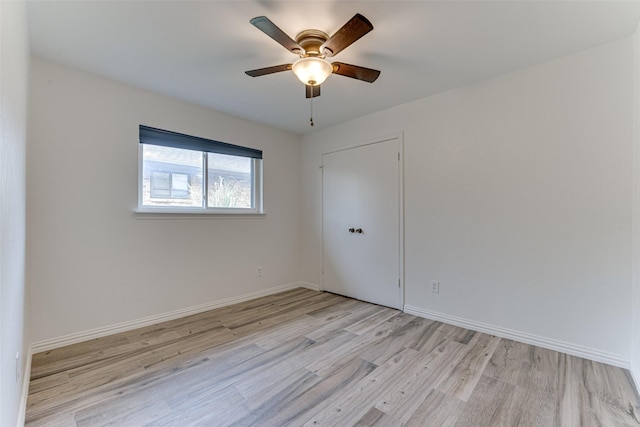 spare room with ceiling fan and light hardwood / wood-style flooring