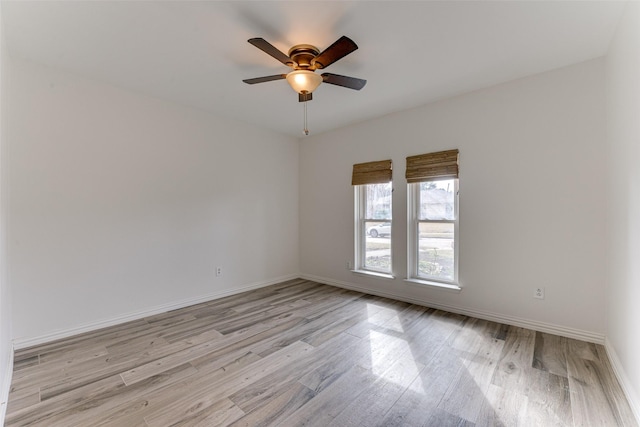 unfurnished room with ceiling fan and light hardwood / wood-style flooring