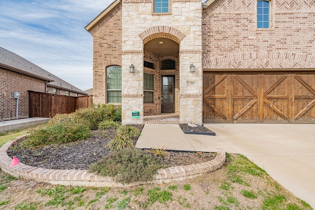 view of exterior entry featuring a garage