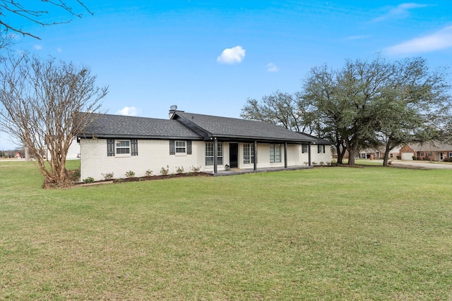 ranch-style home featuring a front yard