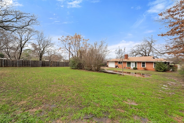 view of yard featuring a garage