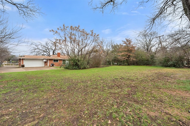 view of yard featuring a garage