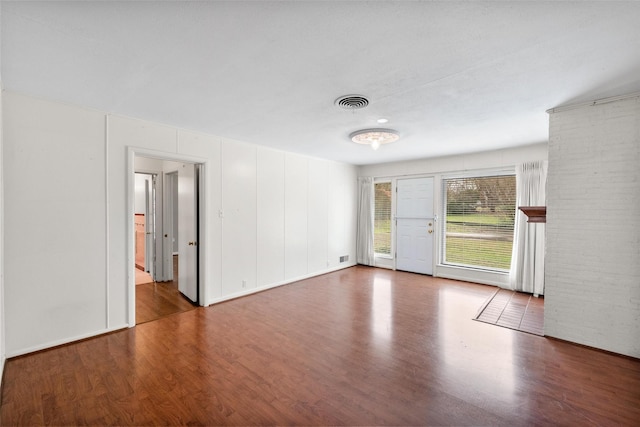 unfurnished room featuring hardwood / wood-style flooring