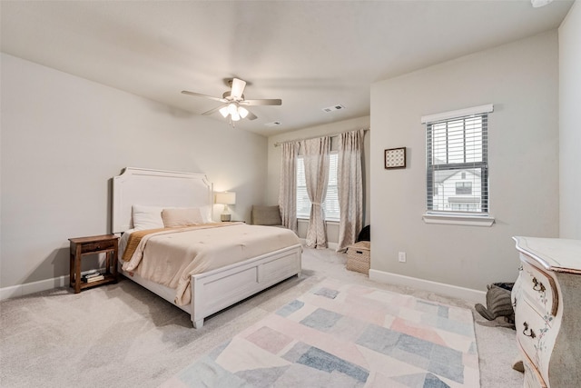 bedroom with light carpet and ceiling fan