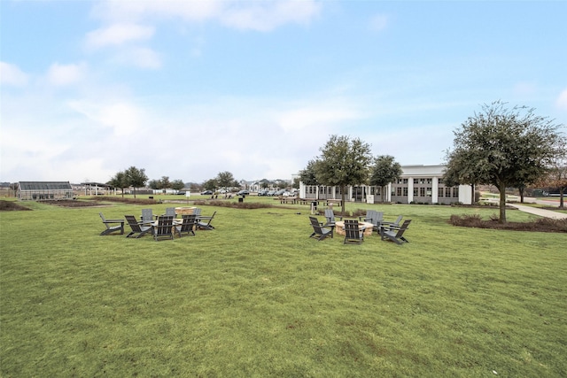 view of yard with a fire pit