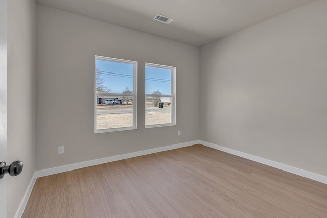 unfurnished room with light hardwood / wood-style flooring