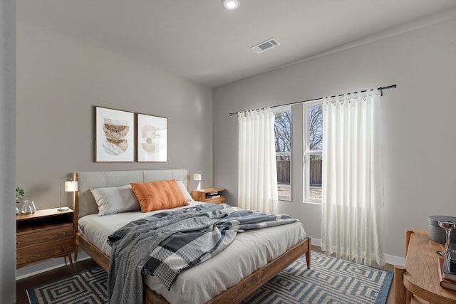 bedroom with hardwood / wood-style floors