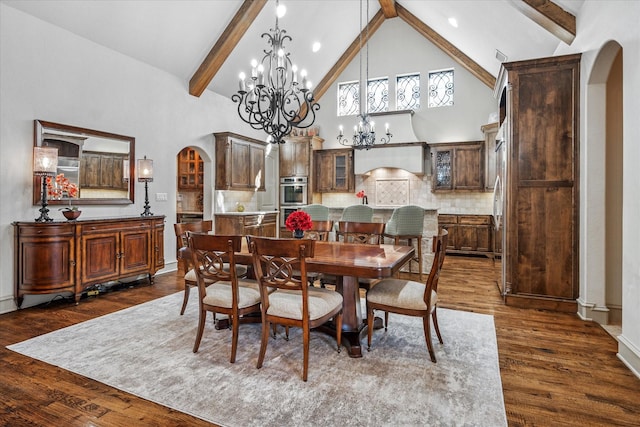 dining space featuring arched walkways, high vaulted ceiling, dark wood-type flooring, and beam ceiling