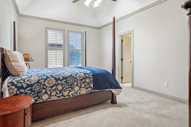 carpeted bedroom with ornamental molding and a ceiling fan