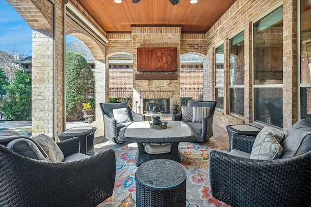 view of patio / terrace featuring an outdoor living space with a fireplace