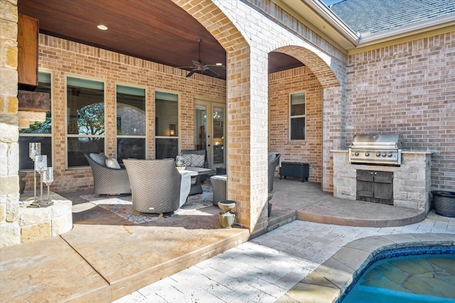 view of patio featuring ceiling fan, an outdoor pool, exterior kitchen, and area for grilling