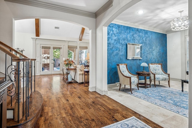 entryway featuring visible vents, baseboards, stairs, beam ceiling, and crown molding