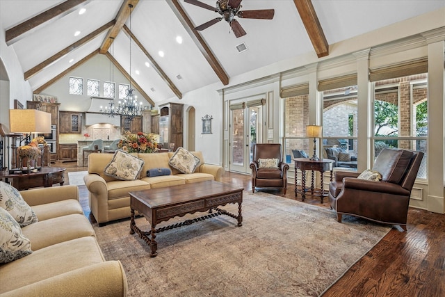 living area featuring arched walkways, high vaulted ceiling, plenty of natural light, and wood finished floors