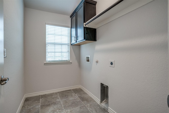 laundry room featuring gas dryer hookup, cabinets, hookup for a washing machine, and hookup for an electric dryer