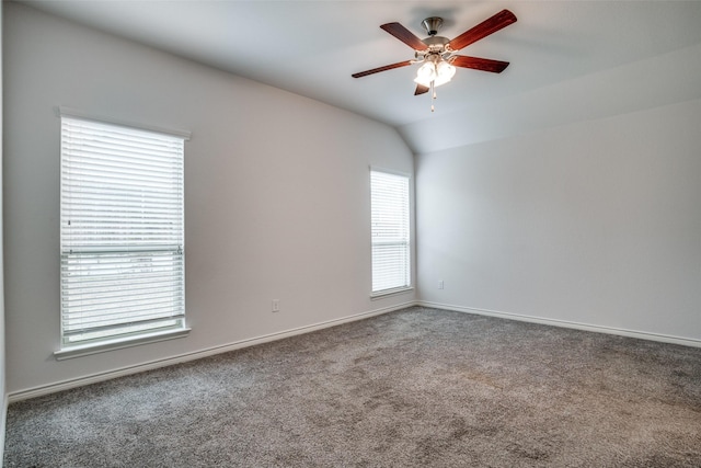 carpeted empty room featuring lofted ceiling and ceiling fan