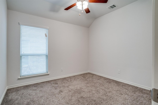 unfurnished room featuring lofted ceiling, carpet floors, and ceiling fan