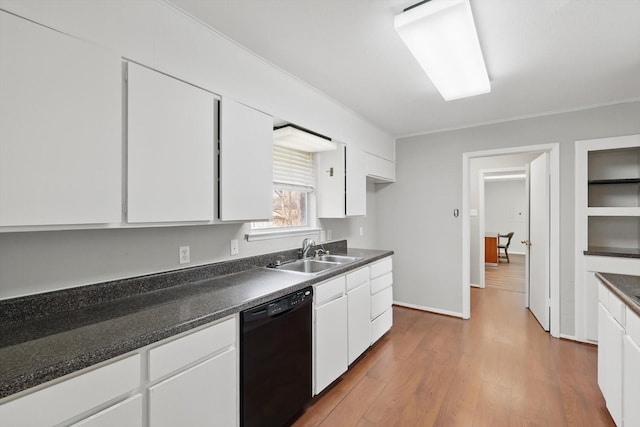 kitchen featuring wood finished floors, a sink, white cabinets, black dishwasher, and dark countertops