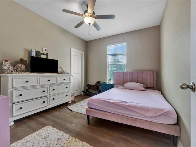 bedroom featuring ceiling fan and dark hardwood / wood-style flooring