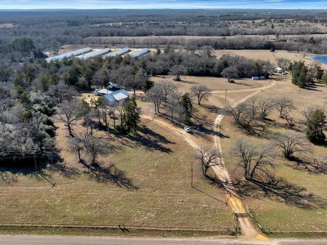 birds eye view of property with a rural view