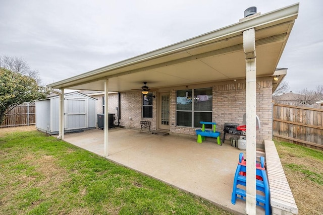 view of patio featuring ceiling fan, a storage shed, and central AC unit