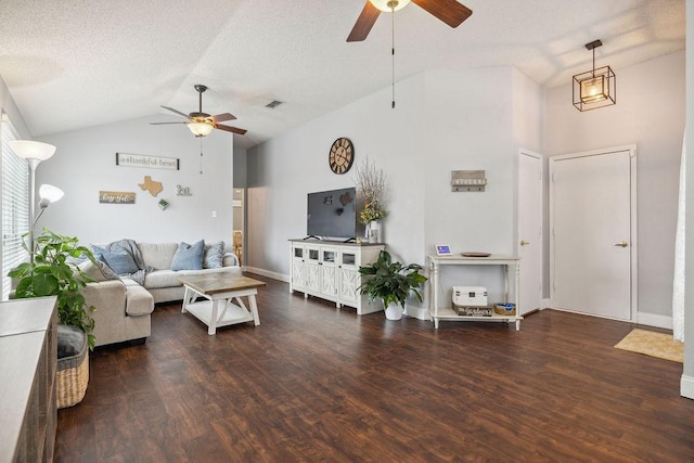 living room featuring ceiling fan, vaulted ceiling, dark hardwood / wood-style floors, and a textured ceiling