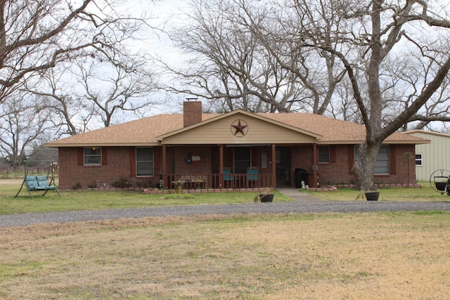 single story home featuring a front yard