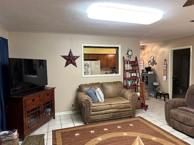 tiled living room with a textured ceiling