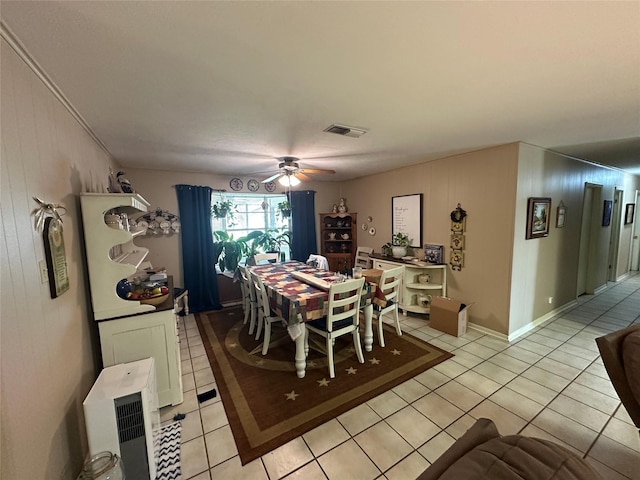 dining space with light tile patterned floors and ceiling fan